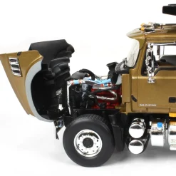 1/34 Gold & Black Mack Granite MP Engine Series Dump Truck by First Gear