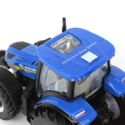 1/64 New Holland T6.180 w/ Roll-Belt 560 Round Baler & 6 Bales, 50 Years Round Baling, 2024 Farm Show