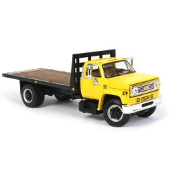 1/64 Yellow Chevy C65 Single Axle Truck with Black Flatbed, DCP by First Gear
