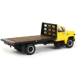 1/64 Yellow Chevy C65 Single Axle Truck with Black Flatbed, DCP by First Gear